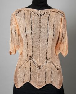 Apricot top knitted in art silk (rayon) with lacy sections.