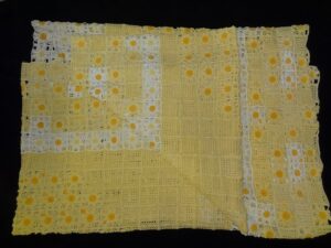 Yellow and white crochet beadspread