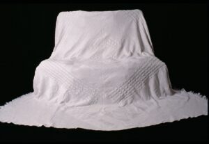 Knitted bedspread displayed to show its full extent