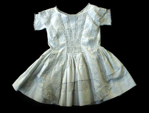 Dress with solid skirt and sides with lacework over