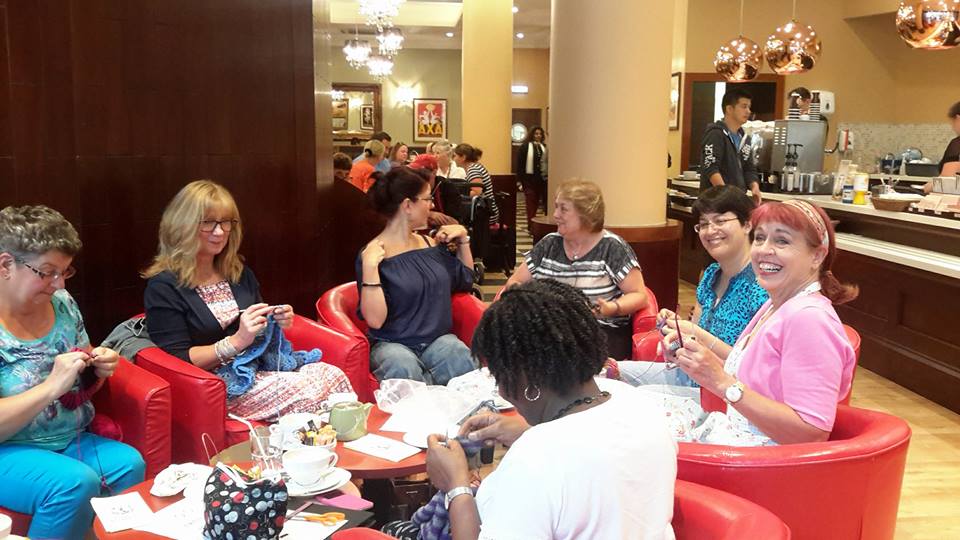 Group of crocheters in a cafe