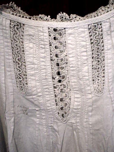 Detail of camisole showing crochet panels and neckline