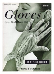 Cover of Gloves in Stylish Crochet. Photograph of lady's hand with network patterned gloves with an elegant elongated leaf shape from the wrist to base of middle finger.
