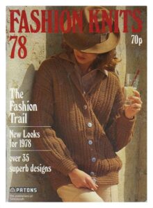 Cover of Fashion Knits 78 - showing lady wearing Fedora hat and cabled cardigan with shawl collar