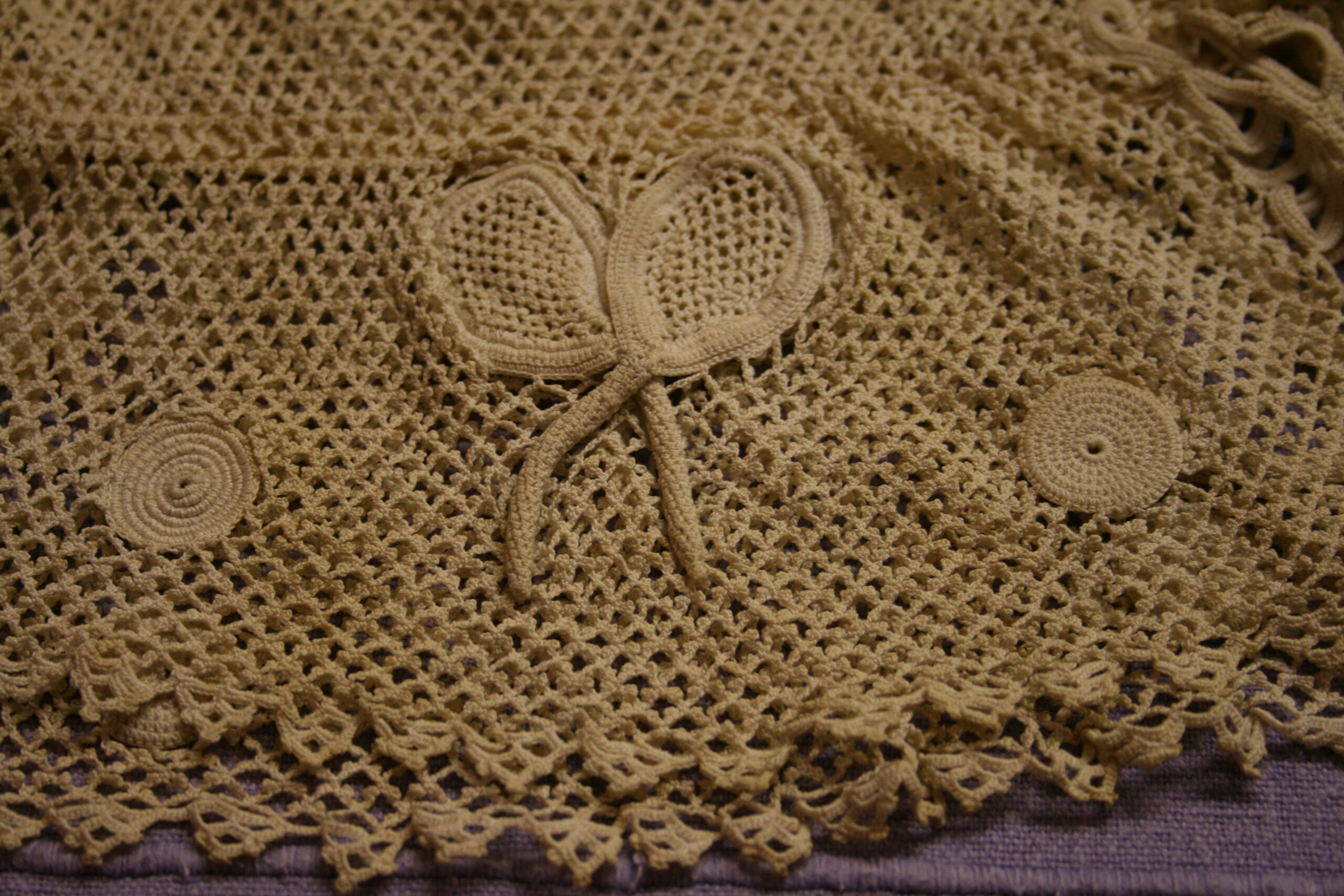 Tennis racquet detail on a crochet top