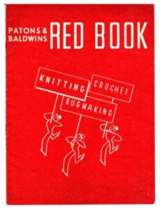 Cover of Patons & Baldwin Red Book. Cartoon of three simply drawn figures each carrying a placard above their heads, one word each. Knitting, Crochet, Rugmaking.