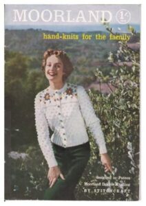 Cover of Stitchcraft 32 showing lady with white textured cardigan with white floral motif around the shoulders.
