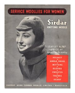 Cover of Service Woollies for Women. Lady wearing balaclava. Instructions for making: helmet, ankle socks, mittens, gloves, sweater, trunks, scarf