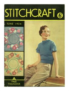 Cover of Stitchcraft June 1934. Lady wearing blue knitted top with white bobbles on shoulders.