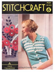 Cover of Stitchcraft May 1935 with lady in blue and white short sleeve jacket and a separate picture of embroidered flowers.