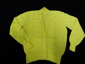 Yellow cardigan knit with twisted cables
