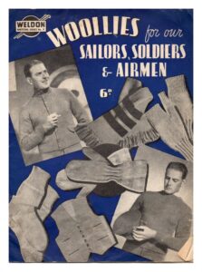 Cover of Woollies for our sailors, soldiers & airmen. Photos of scarf, hat, miggerns, fingerless mittens, socks, waistcoat and photos of a man waring a cardigan and another wearing a sweater.