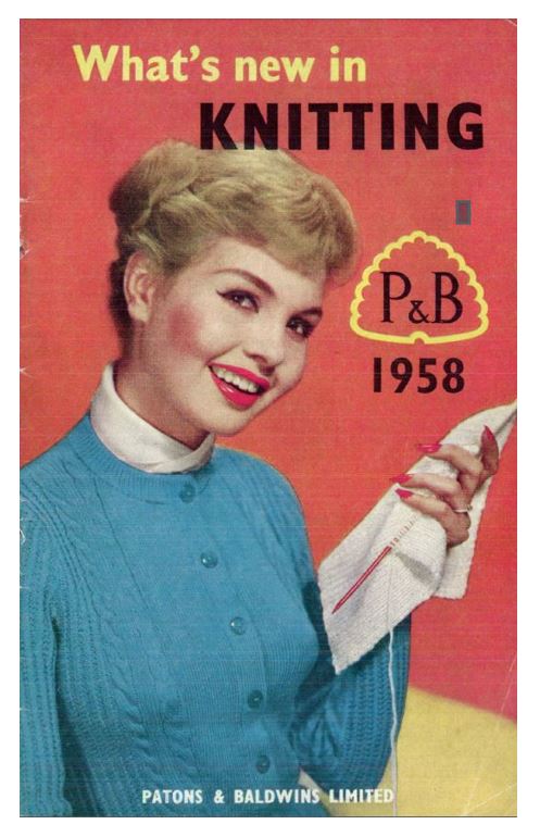 Cover of Whats new in Knitting 1958. PHotograph off lady wearing cardigan with cables and ribbing holding her stocking stitch knitting in her left hand.