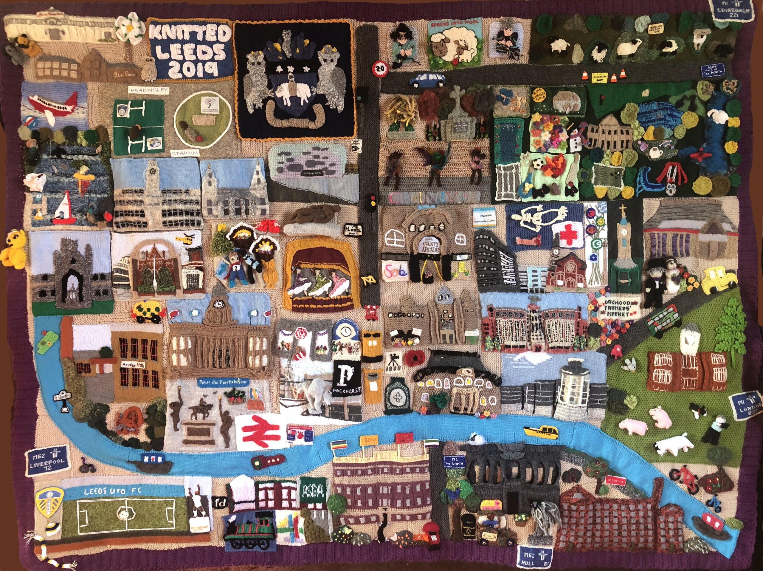 Knitted representation of Leeds. Knitted landmarks are placed in their approximate positions in the city.