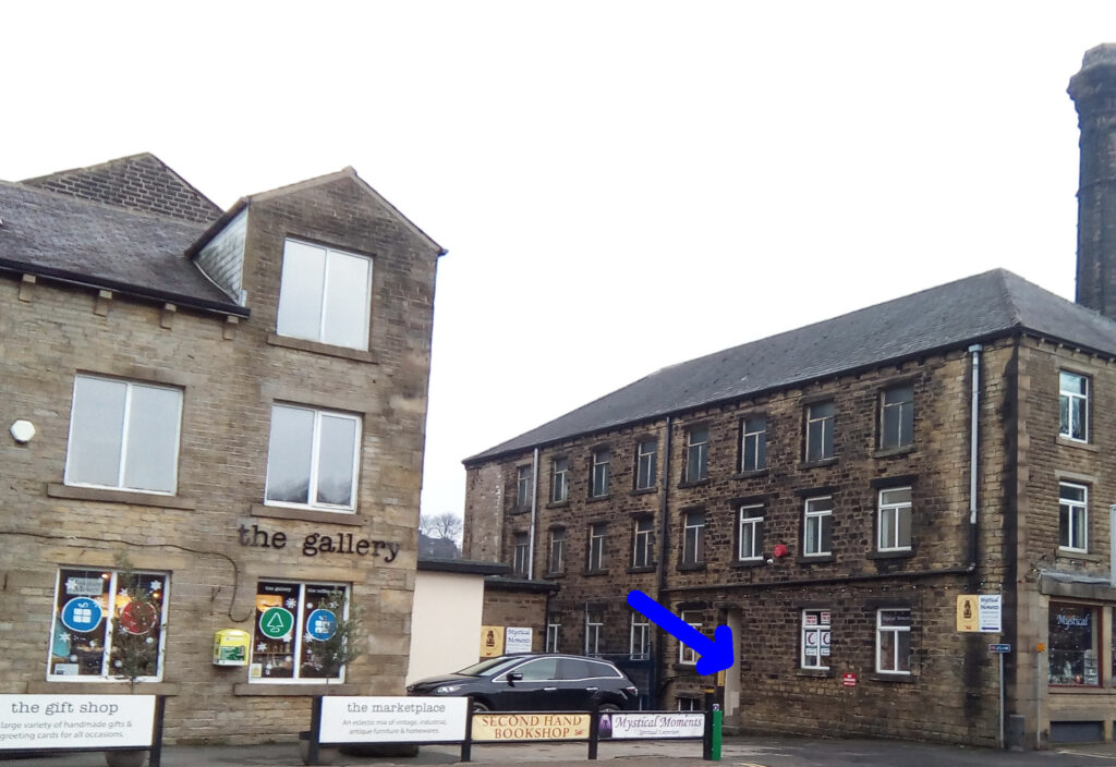 Photograph of Britannia Mill with arrow pointing to entrance.