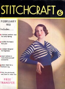 Front cover of Stitchcraft February 1933. Photograph of lady wearing horizontal-striped jumper with dramatic V shape neck drawing in the stripes at the centre.