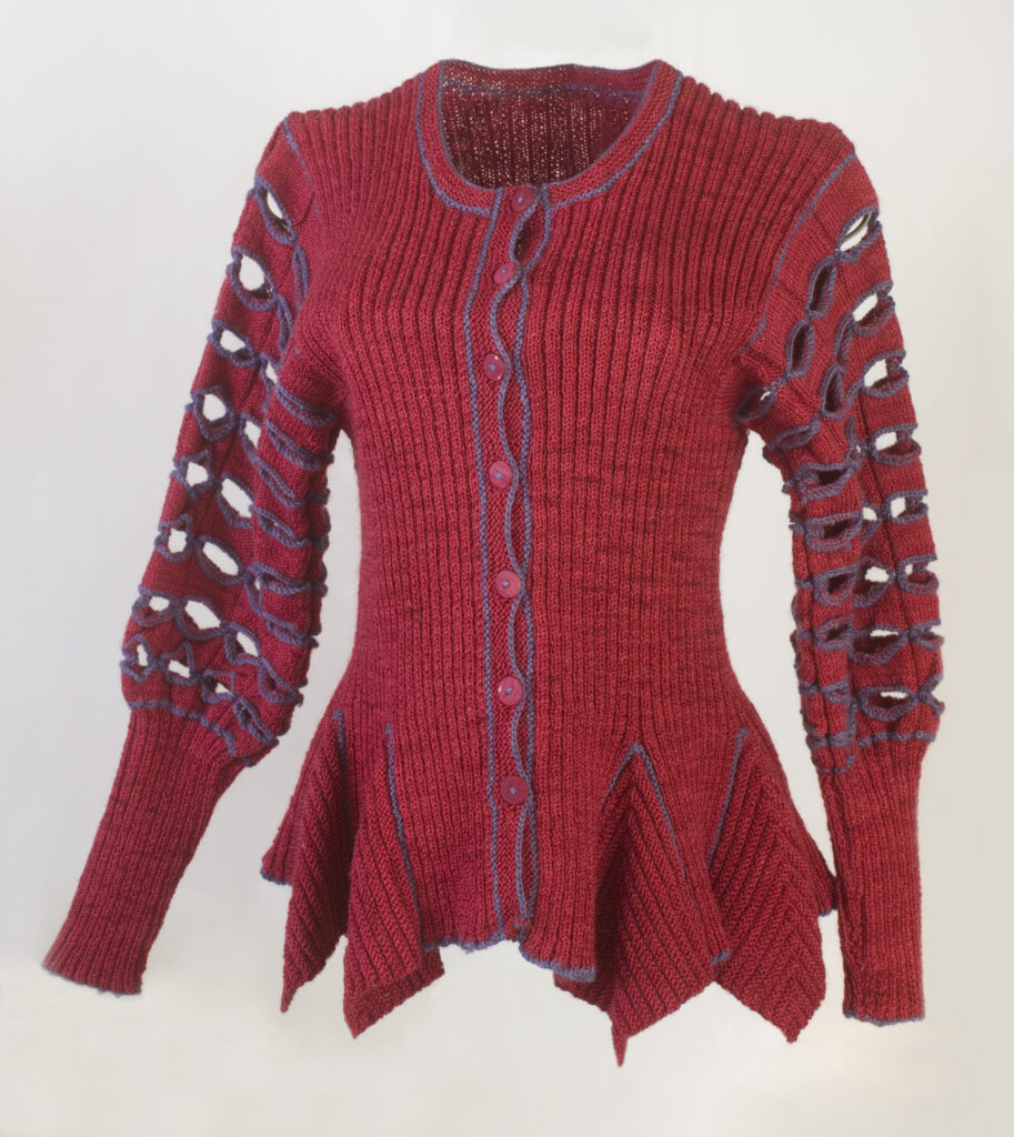 Dramatic red cardigan with ragged bottom and "holey" sleeves