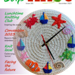 Cover of Slipknot 181, December 2023, featuring crochet'd clock with colourful maritime motifs where the numbers would be.