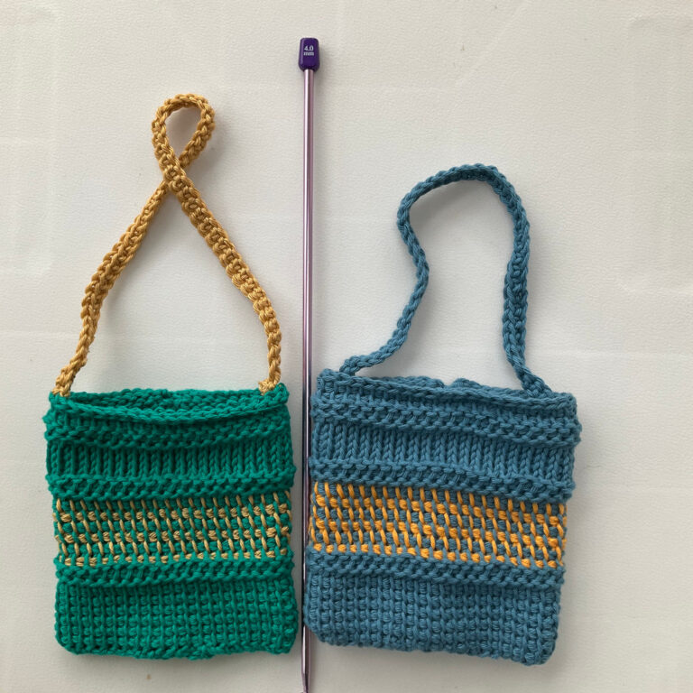 Two bags made with Tunisian Crochet. Shown with a Tunisian Crochet hook.