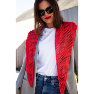 Model waring red knitted openwork scarf