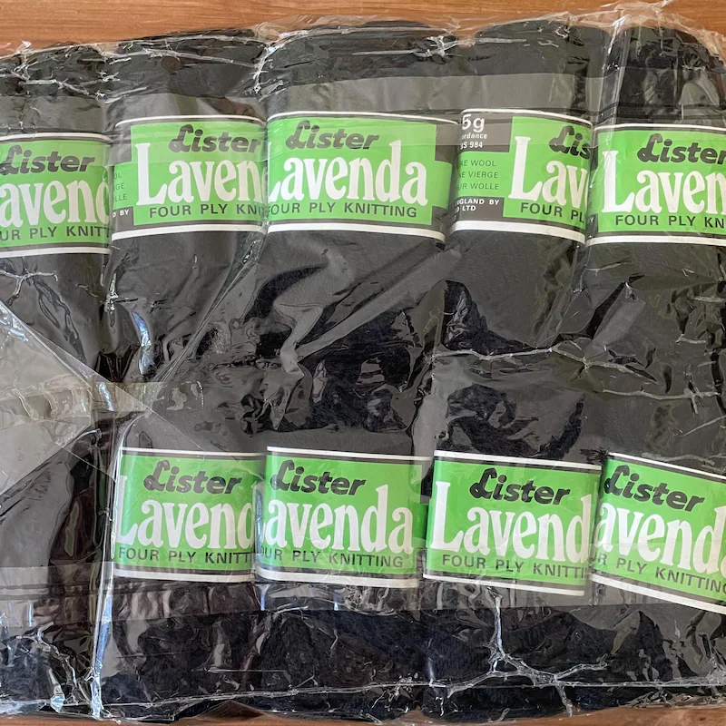 Photo of pack of 10 balls of black vintage Lister Lavenda 4-ply wool.