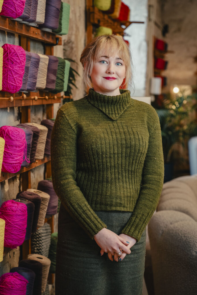 Photo of Ailsa wearing a jumper knit from a vintage pattern.