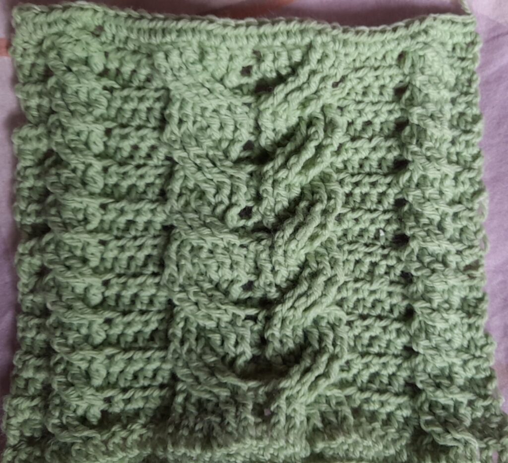 Cabled crochet in pale green.