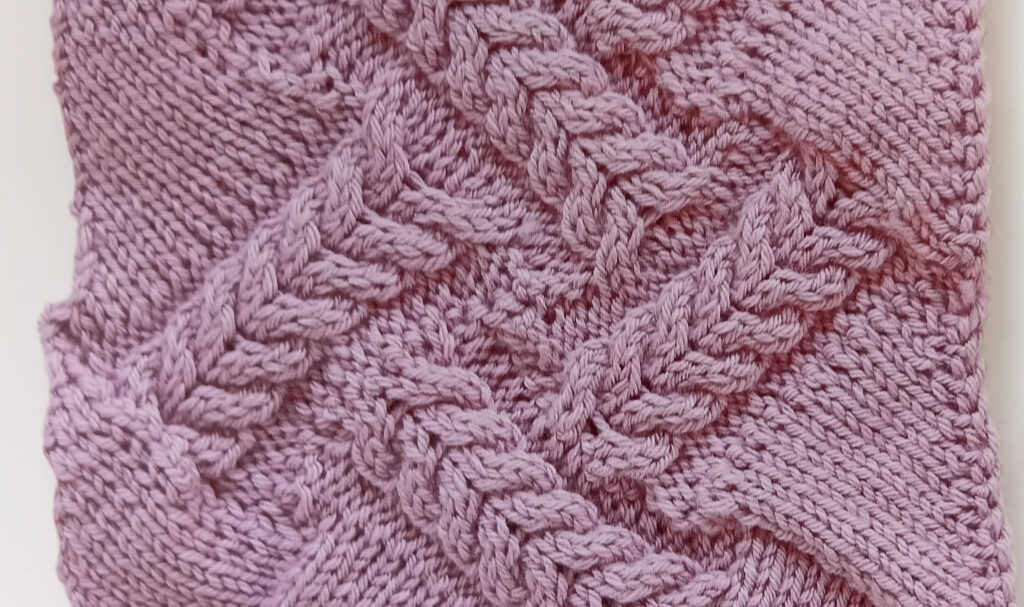 Knitted entrelac with cables