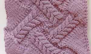 Knitted entrelac with cables